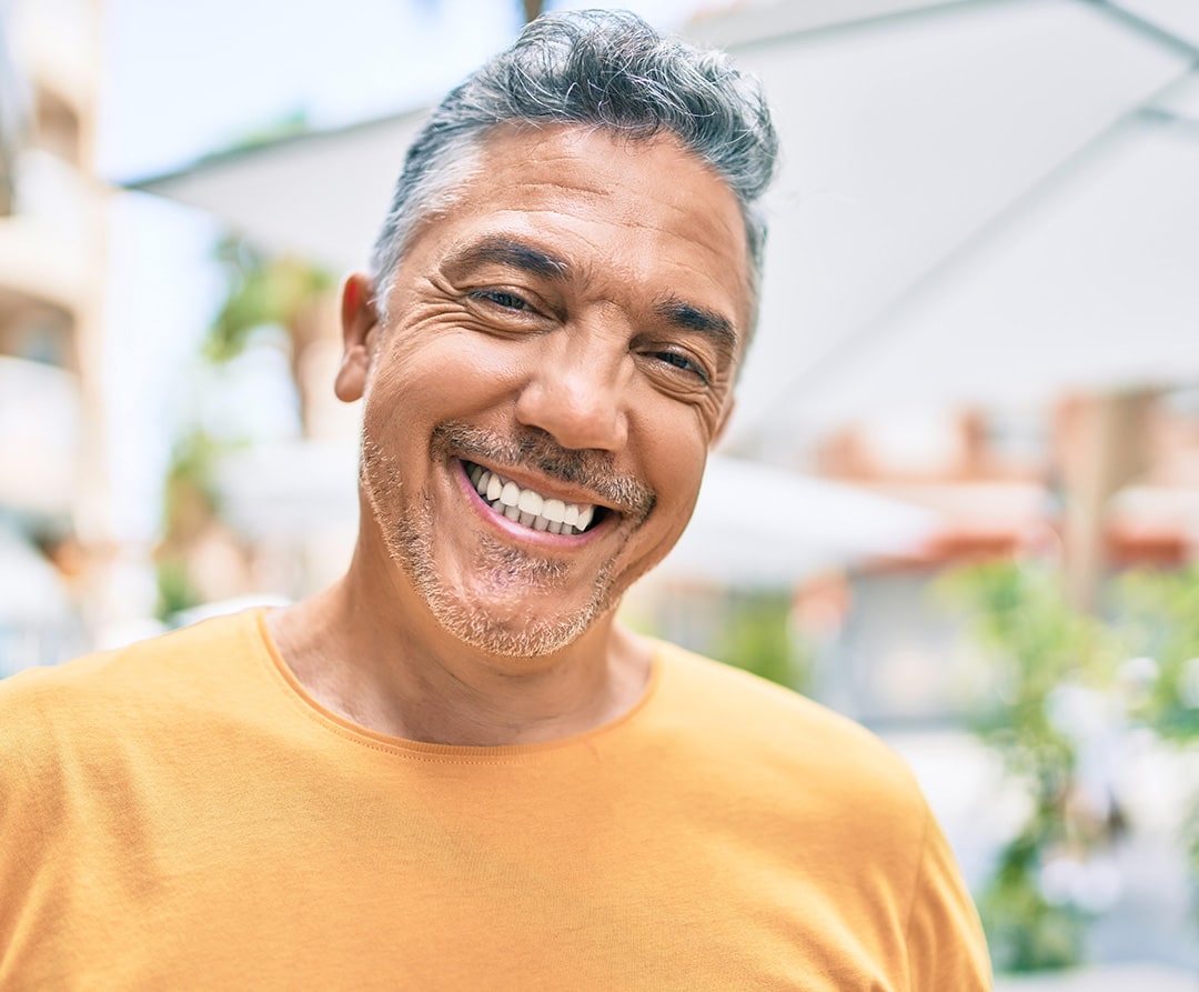 Man smiling with quality dental care in El Paso, TX