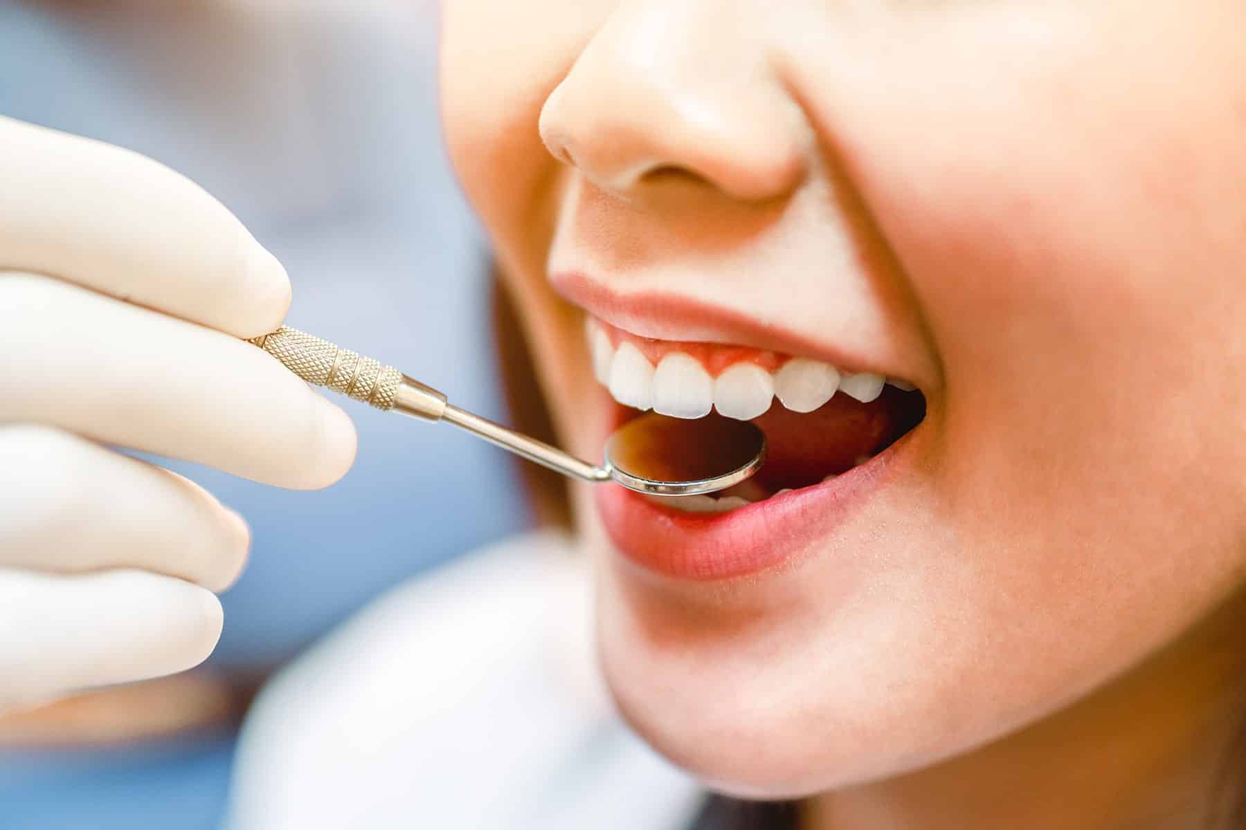 Man getting a dental cleaning in El Paso, TX